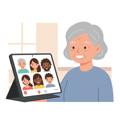 Fototapeta premium An elderly person holds a tablet showing a video call with six diverse faces
