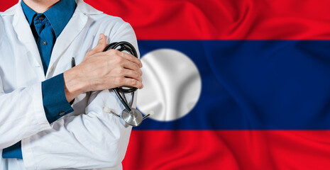 Doctor with stethoscope on Laos flag. Doctor holding stethoscope on Laos flag