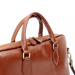 Detail of an elegant tan leather laptop bag isolated on white background, perfect for leather...