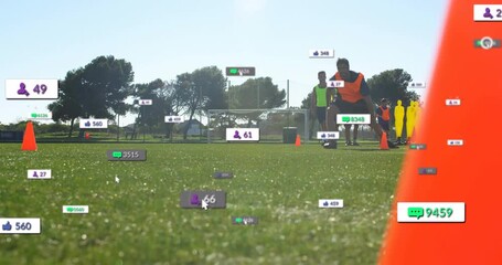 Digital metrics appearing motivating athlete lunging left grabbing cone during soccer training - Powered by Adobe