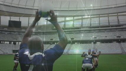 Thrower wearing number 2 throwing underhand into rugby lineout lifters raising jumper catching ball