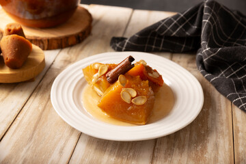 Calabaza en Tacha. Spiced Candied Pumpkin. Mexican dessert whose main ingredients are pumpkin and piloncillo, also known as Chacualole or Dulce de Calabaza, widely used in Day of the Dead offerings.