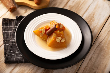 Calabaza en Tacha. Spiced Candied Pumpkin. Mexican dessert whose main ingredients are pumpkin and piloncillo, also known as Chacualole or Dulce de Calabaza, widely used in Day of the Dead offerings.