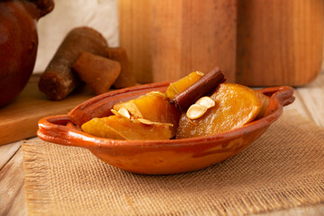 Calabaza en Tacha. Spiced Candied Pumpkin. Mexican dessert whose main ingredients are pumpkin and piloncillo, also known as Chacualole or Dulce de Calabaza, widely used in Day of the Dead offerings.