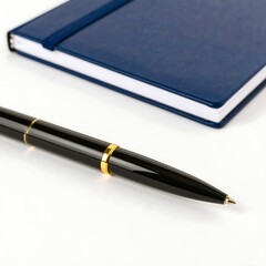 Navy blue notebook and black pen