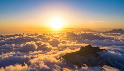 Obraz premium Breathtaking Sunrise Over Mountain Peaks and Clouds at Dusk