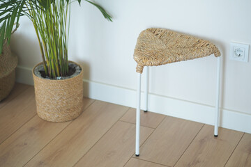 Stylish triangular stool in a cozy indoor setting