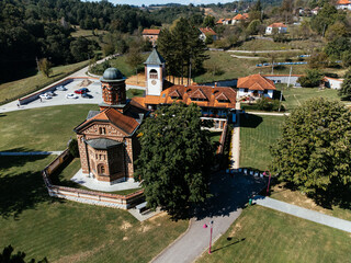 Aerial view of Church of Saint Basil of Ostrog near Valjevo, Serbia, surrounded by rural landscape....