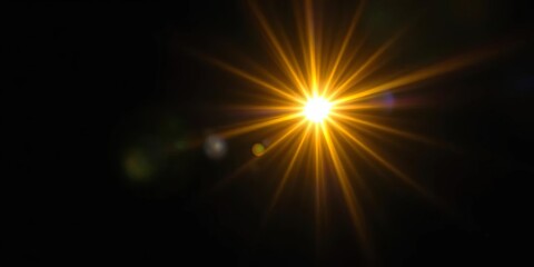 Intense yellow lens flare and light beam burst on black background,  optical,  sun