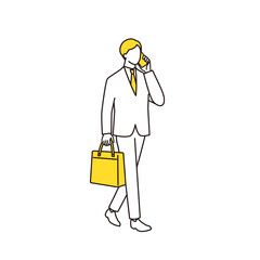 通勤中にスマホで話しているビジネスマン