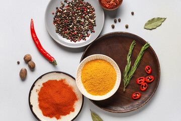 Composition with fresh aromatic spices on grey background