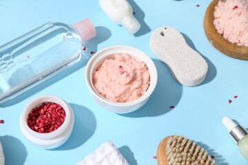 Composition with natural body scrubs, bath supplies and cosmetic products on color background