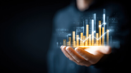 Hand holding digital graph with rising bars and lines, symbolizing growth and success in business analytics and finance. image conveys sense of innovation and progress