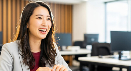 Smiling Young Asian Professional in a Modern Office Environment