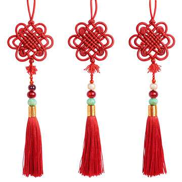 Traditional Chinese red knot ornaments with tassels for cultural decoration and festive occasions