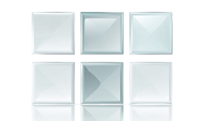 Grid of light gray, square glass tiles.  Reflecting light