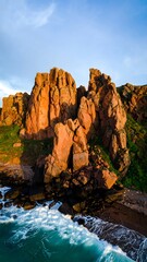 Obraz premium Dramatic coastal rocks at sunset