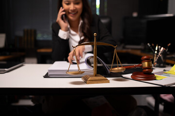Female lawyer is working on legal documents in an office.	
