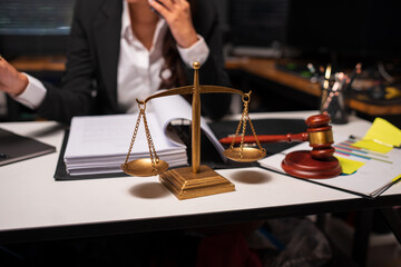 Female lawyer is working on legal documents in an office.	