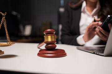 Female lawyer is working on legal documents in an office.	
