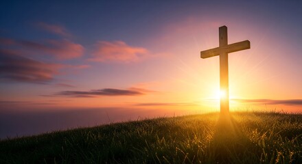 Religious Christian cross silhouetted against a brilliant sunrise over a grassy hill, symbolizing faith, hope, and new beginnings,  copy space