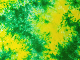 Abstract tie-dye fabric in vibrant greens and yellows