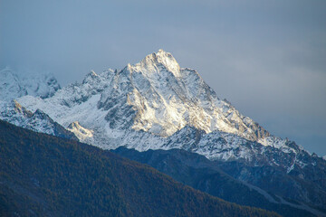 Jagged, snowy peaks loom under a cloudy sky
Yala Snow Mountain, Sichuan, China