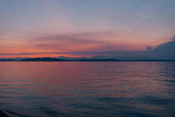 pink and blue summer sunset over the sea. Seattle