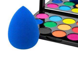 Blue makeup sponge with a colorful cosmetic eyeshadow palette on a transparent background