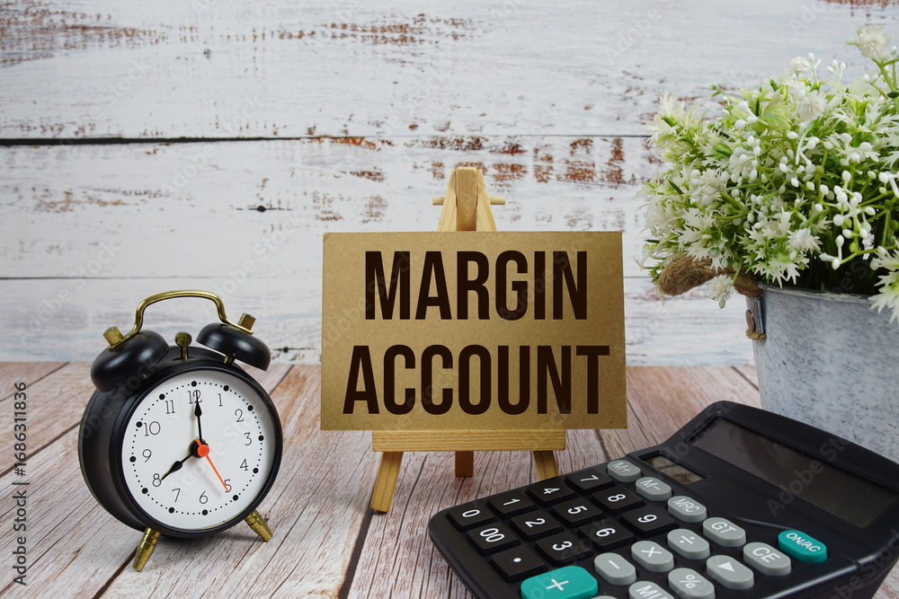 Poster margin account text with alarm clock and calculator on wooden background