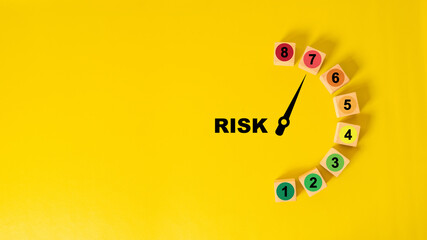 Risk level indicator rating print screen wooden cube block since low to high on yellow background for Risk management and assessment concept