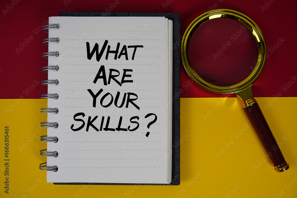 Poster what are your skills? text written on notebook paper with magnifying glass