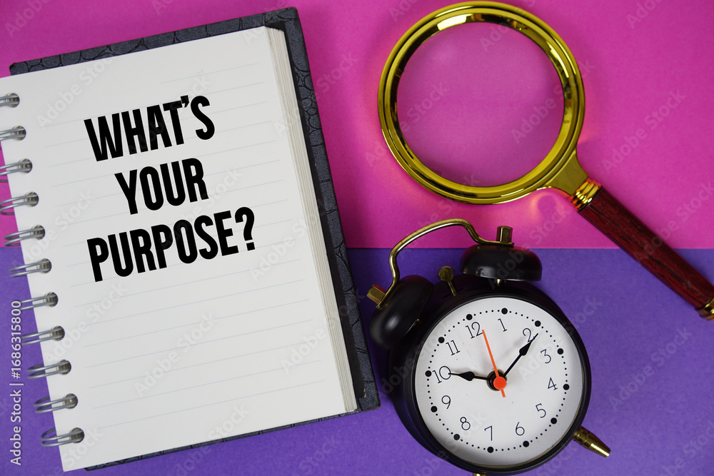 Poster What's Your Purpose? text written on notebook paper with magnifying glass and alarm clock