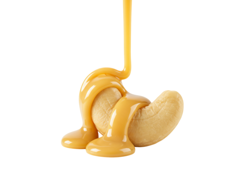 Cashew nut drizzled with caramel sauce on transparent background