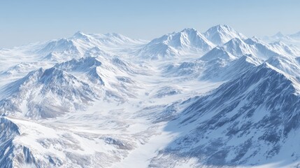 Fototapeta premium Breathtaking expansive snow capped mountain range with rugged peaks and deep valleys under clear blue sky in winter landscape view