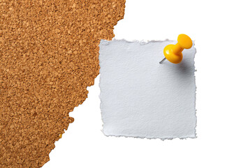 A torn piece of white paper affixed to a corkboard with a yellow pushpin