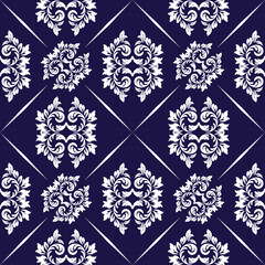 Elegant and intricate floral pattern in a seamless design. The stylized floral elements are arranged in a grid pattern. The overall composition is visually balanced and pleasing