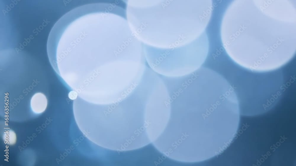 Poster a serene and soft background filled with gentle blue bokeh lights. perfect for evoking calmness and 