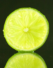 Juicy lime half, reflective surface
