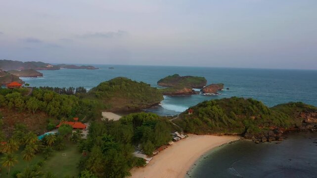 Aerial view drone of Watu Karung beach and Kasap beach when evening prayer arrives