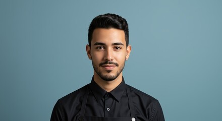Obraz premium Confident Young Man Smiling Against Blue Background