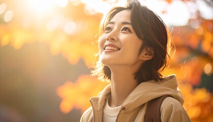 A woman impressed by autumn leaves
