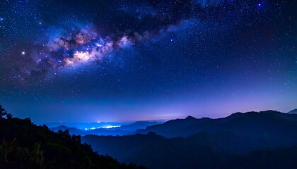 Naklejka premium Starry night over misty mountains (1)