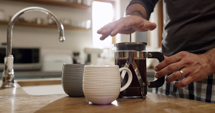 Hands, man and french press for coffee in kitchen with morning routine, prepare beverage and latte. Home, plunger and person making espresso with filter for caffeine, drink and brewing process - Powered by Adobe