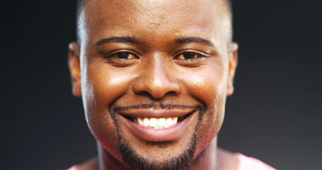 Obraz premium Dental, face and portrait of black man in studio with satisfaction for oral care or hygiene. Dentistry, smile and teeth of happy African model on dark background for whitening benefits or results