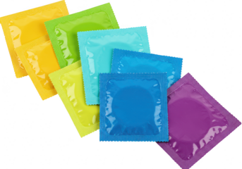 Variety of colorful condoms in individual wrappers isolated on transparent background