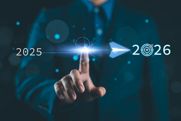 Concept of business transformation and future planning from 2025 to 2026 showing finger launching red arrow toward goal, strategic roadmap for success, representing leadership, direction