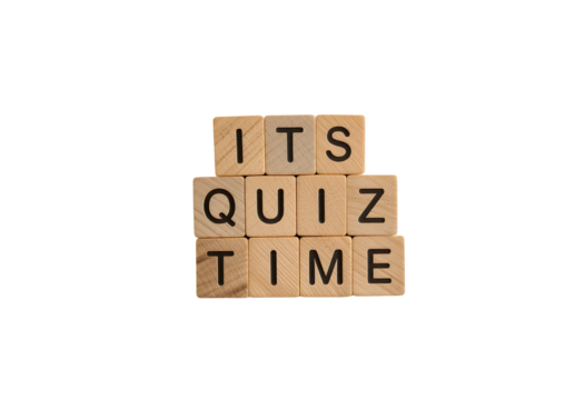 wooden blocks arranged to spell out the phrase its quiz time on black background