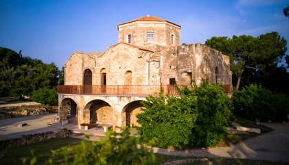 Ancient stone church ruins in a sunny park setting