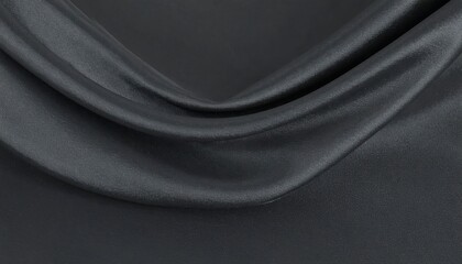 Close-up view of dark gray fabric with soft folds